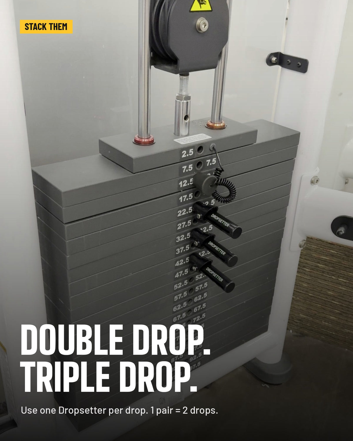 Three Dropsetters lined up in a weight stack for a triple drop set