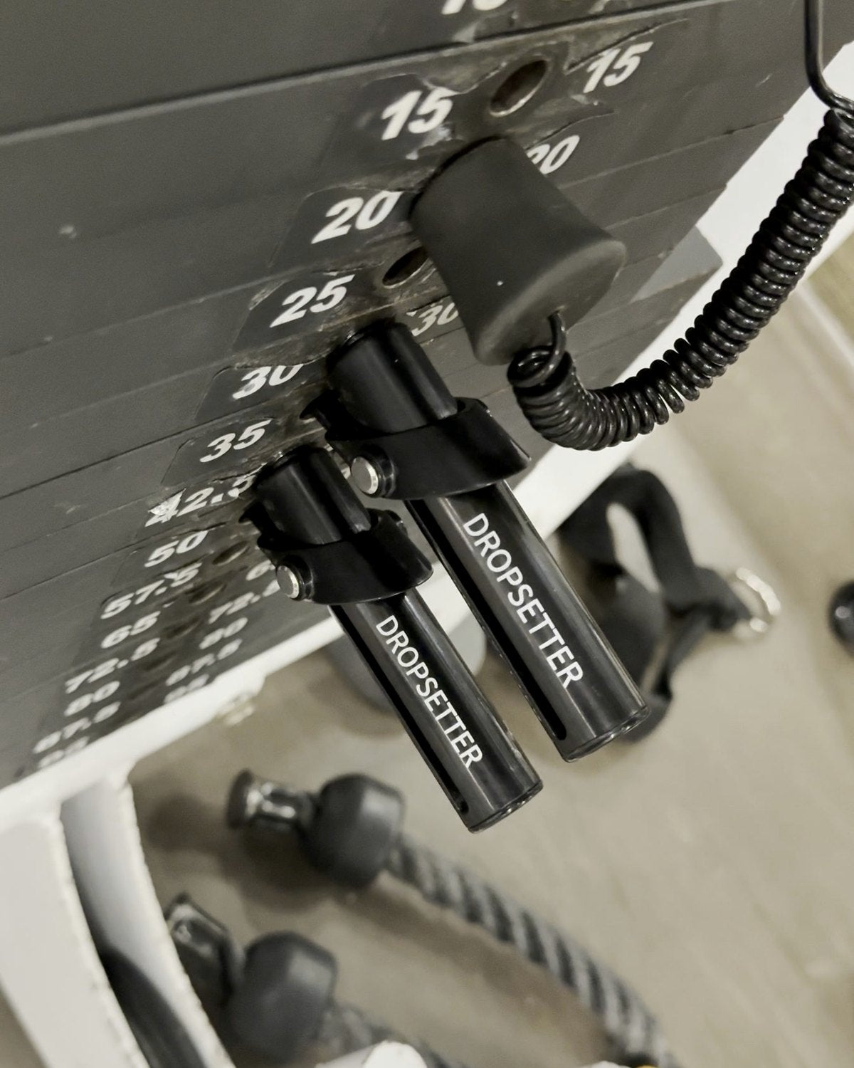 Close-up of Dropsetters in a weight stack